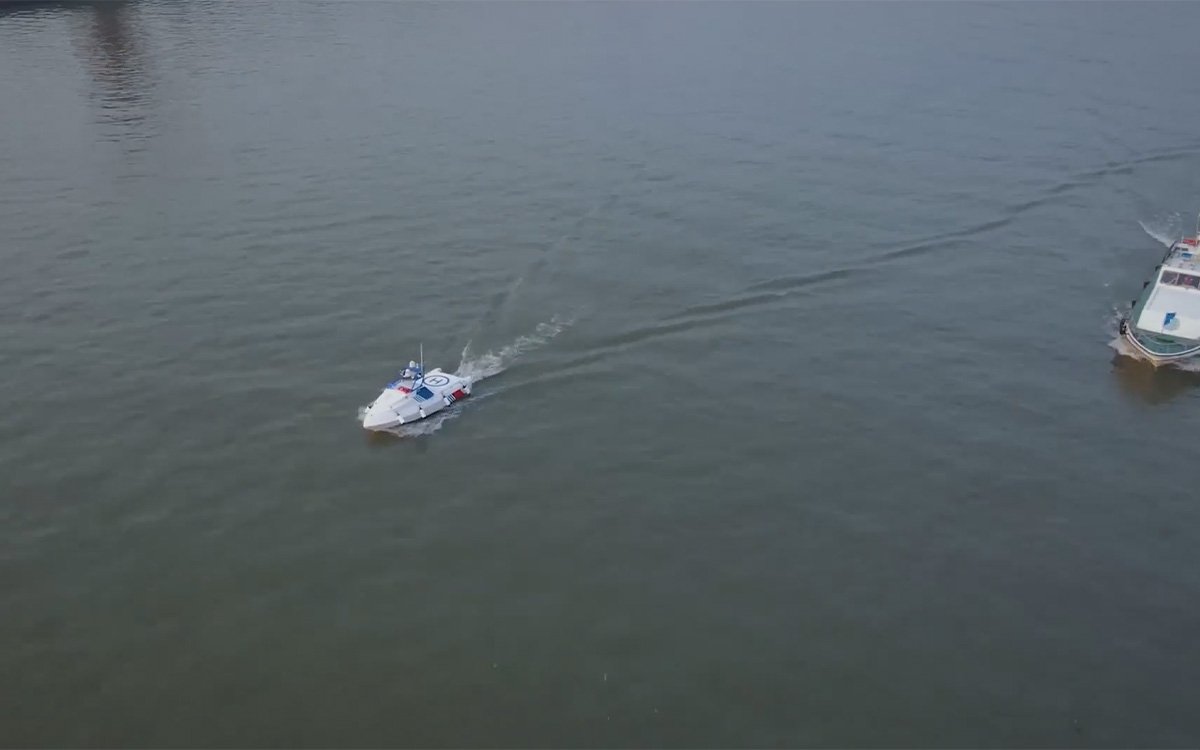 eSV unmanned vessel operating across a vast lake horizon at dawn