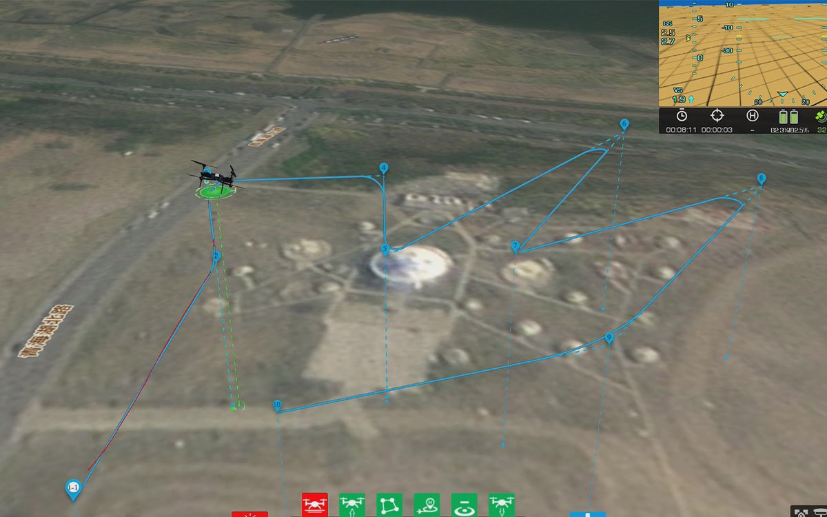 eX4 quadcopter operating at long range with ground control station in background