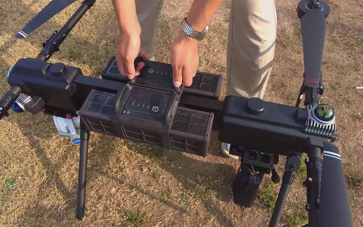 eX4 quadcopter flying in light rain with sealed protection housing visible